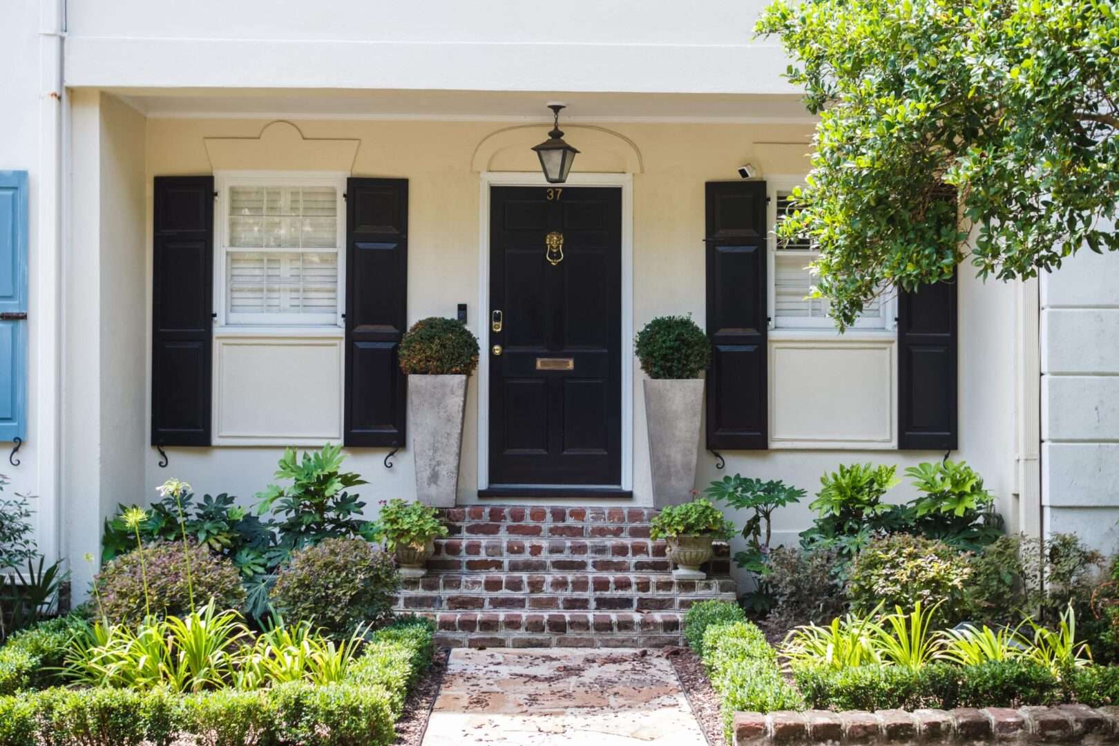 Beautifully decorated symmetrical facade of a light house on a summer day. Beautiful landscape design. Charleston, South Carolina / USA - July 21, 2018