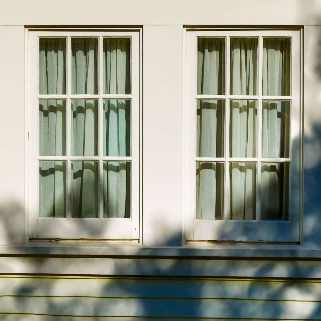 a white window with curtains