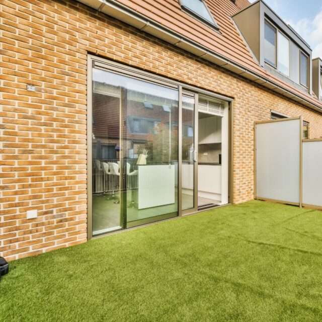 a brick building with a glass door