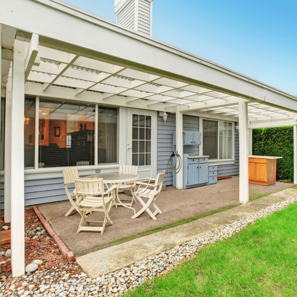 house exterior with chairs and table