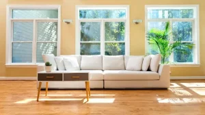 Bright living room with impact windows showing how impact windows insurance discount Florida benefits homeowners.