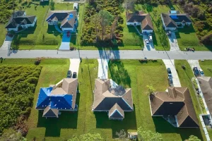 Aerial view of homes after wind mitigation inspection Florida upgrades for roofing and storm protection.