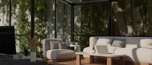Screened porch vs glass enclosure comparison featuring a modern glass-enclosed patio with indoor-style seating.